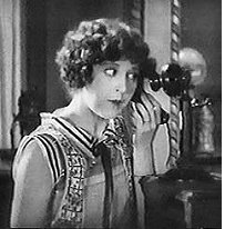 Woman eavesdropping on telephone